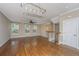 Spacious living room with hardwood floors, ample natural light, and a ceiling fan at 9305 Sweetbay Ct, Ladson, SC 29456