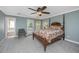 Bedroom with a four-poster bed, ceiling fan, and access to a private balcony at 9305 Sweetbay Ct, Ladson, SC 29456