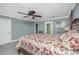 Bedroom with a four-poster bed, ceiling fan, and access to a private balcony at 9305 Sweetbay Ct, Ladson, SC 29456