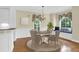 Dining room with a table, decorative chandelier, and a bay window at 1025 Mathis Ferry Rd, Mount Pleasant, SC 29464