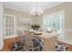 Elegant dining room featuring a modern table and chandelier lighting at 1025 Mathis Ferry Rd, Mount Pleasant, SC 29464