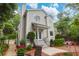Charming home exterior featuring manicured landscaping, a brick patio, and an inviting front porch at 1025 Mathis Ferry Rd, Mount Pleasant, SC 29464