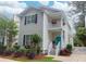 Charming two-story home boasts a second-story balcony and a vibrant turquoise front door at 1025 Mathis Ferry Rd, Mount Pleasant, SC 29464