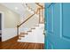 Welcoming foyer with a staircase featuring wood banister and trim and hardwood floors at 1025 Mathis Ferry Rd, Mount Pleasant, SC 29464