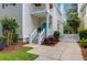 Charming two-story home boasts a second-story balcony and a vibrant turquoise front door at 1025 Mathis Ferry Rd, Mount Pleasant, SC 29464