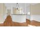 Eat-in kitchen features pendant lighting, breakfast bar, and white cabinets at 1025 Mathis Ferry Rd, Mount Pleasant, SC 29464