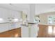 The spacious kitchen features white cabinets, island, and stainless appliances, ideal for cooking and entertaining at 1025 Mathis Ferry Rd, Mount Pleasant, SC 29464