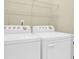 Washer and dryer with wire shelving in the laundry room at 1025 Mathis Ferry Rd, Mount Pleasant, SC 29464