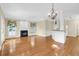 Spacious living room with a fireplace, hardwood floors, and a seamless flow into the kitchen at 1025 Mathis Ferry Rd, Mount Pleasant, SC 29464