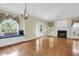 Bright living room featuring a fireplace, hardwood floors, and a built-in window seat at 1025 Mathis Ferry Rd, Mount Pleasant, SC 29464