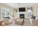 Cozy living room with fireplace, French doors, and comfortable seating area at 1025 Mathis Ferry Rd, Mount Pleasant, SC 29464