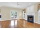 Bright living room featuring a fireplace, french doors, and beautiful hardwood floors at 1025 Mathis Ferry Rd, Mount Pleasant, SC 29464