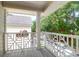 Charming porch with white railings and flower boxes overlooking the street at 1025 Mathis Ferry Rd, Mount Pleasant, SC 29464
