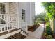 Inviting side yard with a walkway leading to a private outdoor space, complemented by arched trellis at 1025 Mathis Ferry Rd, Mount Pleasant, SC 29464