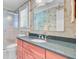 Bathroom features a granite countertop, wood cabinets, a walk-in shower, and floral wallpaper at 107 Kimberwicke Dr, Summerville, SC 29483