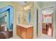 Bathroom featuring wood cabinets, white countertops, and views into other rooms at 107 Kimberwicke Dr, Summerville, SC 29483