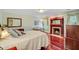 Comfortable bedroom featuring a fireplace, hardwood floors, and natural light at 107 Kimberwicke Dr, Summerville, SC 29483