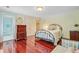 Sunlit bedroom boasts hardwood floors, double closets, and decorative furniture at 107 Kimberwicke Dr, Summerville, SC 29483