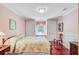 Cozy bedroom with hardwood floors, neutral pink walls, and a window seat at 107 Kimberwicke Dr, Summerville, SC 29483