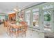 Bright dining area features a chandelier, a wood table, and a door that leads to an outdoor space at 107 Kimberwicke Dr, Summerville, SC 29483