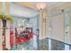 Elegant dining room featuring hardwood floors, a chandelier, and views of the front entrance at 107 Kimberwicke Dr, Summerville, SC 29483