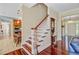 Welcoming entryway featuring hardwood floors and staircase leading to the upper level at 107 Kimberwicke Dr, Summerville, SC 29483