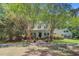 Beautiful two-story home with a lush green yard, a long driveway, and a covered porch at 107 Kimberwicke Dr, Summerville, SC 29483