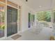 Cozy front porch featuring a classic black front door and charming rocking chairs at 107 Kimberwicke Dr, Summerville, SC 29483