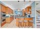 A kitchen features wooden cabinets, granite countertops, a breakfast bar, and stainless steel appliances at 107 Kimberwicke Dr, Summerville, SC 29483