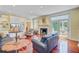 Spacious living room with a fireplace, built-in shelving, and french doors to the outside at 107 Kimberwicke Dr, Summerville, SC 29483