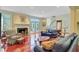 Inviting living room featuring a fireplace, hardwood floors, and comfortable leather seating at 107 Kimberwicke Dr, Summerville, SC 29483