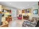 Home office features built-in bookshelves, an accent chair, a desk, and a patterned sofa at 107 Kimberwicke Dr, Summerville, SC 29483