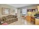 Bright home office includes a sofa, a built-in desk, and a view of a courtyard at 107 Kimberwicke Dr, Summerville, SC 29483