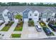 Aerial view of colorful townhomes, showing driveways, landscaping, and neighborhood layout at 108 Rosefield Ct, Summerville, SC 29485