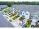 An aerial view displays a community of well-maintained townhomes in a lush, green setting at 108 Rosefield Ct, Summerville, SC 29485
