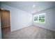 Bright bedroom features neutral carpet, white walls, and a window for natural light at 108 Rosefield Ct, Summerville, SC 29485
