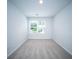 Neutral carpet fills the bright bedroom with white walls and a window at 108 Rosefield Ct, Summerville, SC 29485