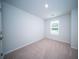 Bright bedroom with neutral carpet, a window for natural light and a minimalist aesthetic at 108 Rosefield Ct, Summerville, SC 29485