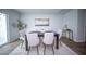 Modern dining room with stylish table and chairs, neutral decor, and natural light at 108 Rosefield Ct, Summerville, SC 29485