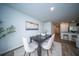 Dining room featuring a modern table, seating, and stylish decor with view into kitchen at 108 Rosefield Ct, Summerville, SC 29485
