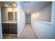 Upstairs hallway featuring plush carpet and access to a full bathroom with dual sink vanity at 108 Rosefield Ct, Summerville, SC 29485