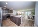 Modern kitchen featuring stainless steel appliances, gray countertops, and sleek dark brown cabinetry at 108 Rosefield Ct, Summerville, SC 29485