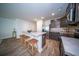 Kitchen featuring island seating, stainless steel appliances, and wood-look flooring at 108 Rosefield Ct, Summerville, SC 29485