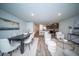 Open-concept living room featuring modern furniture, a dining area, and a view into the kitchen at 108 Rosefield Ct, Summerville, SC 29485