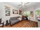 Well-lit room featuring a sofa, ceiling fan, and a window with lush, leafy views at 1121 Basildon Rd, Mount Pleasant, SC 29466