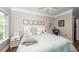 Comfortable bedroom offers a light comforter and ample natural light from the window at 1121 Basildon Rd, Mount Pleasant, SC 29466