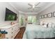 Cozy bedroom with a light blue comforter and door to the balcony showing a wooded view at 1121 Basildon Rd, Mount Pleasant, SC 29466