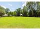 Expansive community lawn with a gazebo, seating, and mature trees at 1121 Basildon Rd, Mount Pleasant, SC 29466