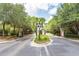 A picturesque gated community entrance with brick pillars and lush green landscaping at 1121 Basildon Rd, Mount Pleasant, SC 29466