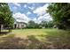 Spacious green lawn with a bench and gazebo, surrounded by a building and trees at 1121 Basildon Rd, Mount Pleasant, SC 29466